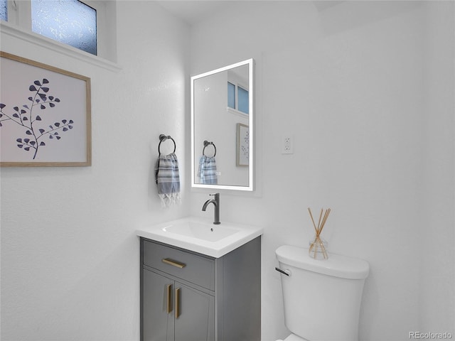 7126 Joan St, Denver, CO 80221 - half bathroom with toilet and vanity