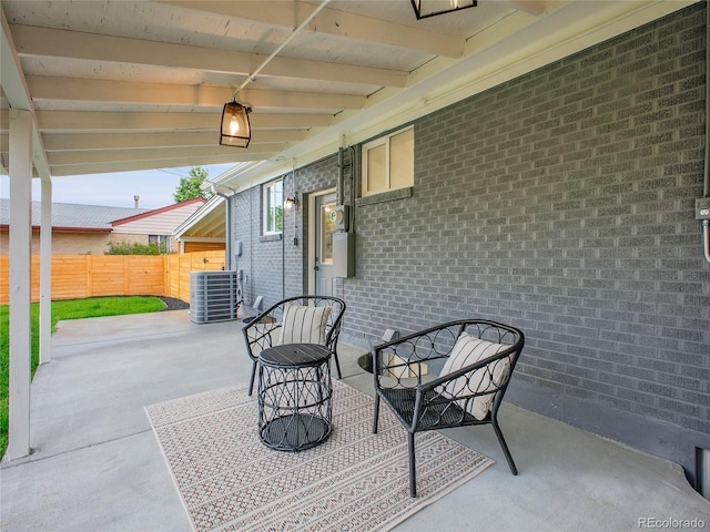 7126 Joan St, Denver, CO 80221 - view of patio featuring central AC unit