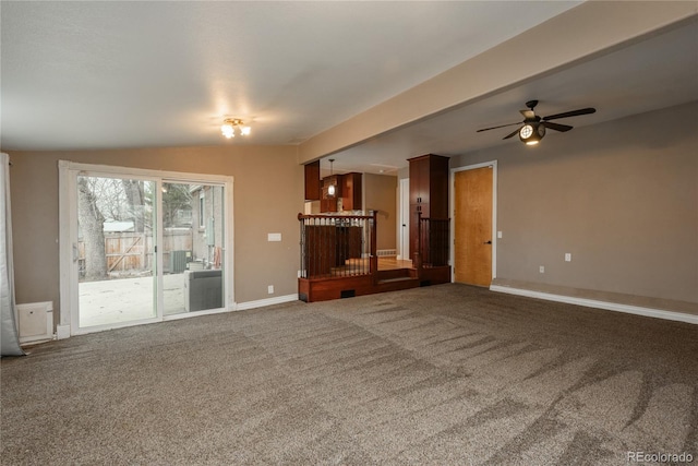 unfurnished living room with ceiling fan, baseboards, lofted ceiling, and carpet floors