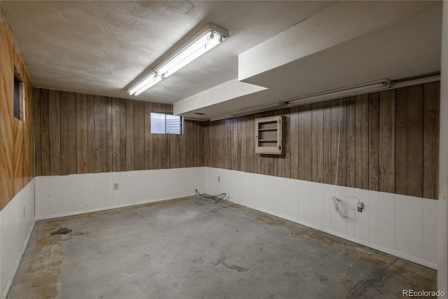 below grade area featuring wood walls