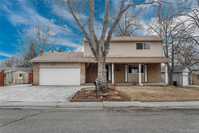 traditional-style home with brick siding, a porch, concrete driveway, and a garage