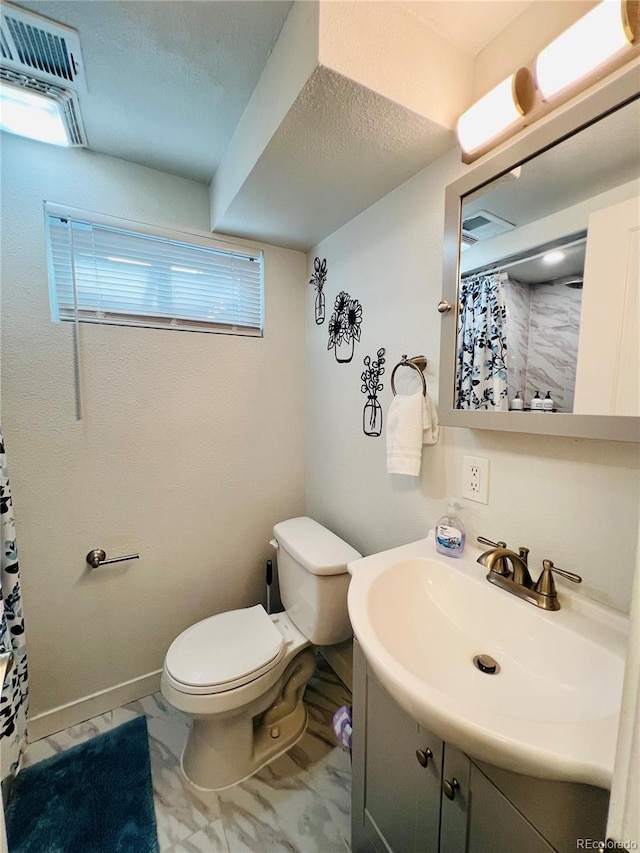 full bathroom with visible vents, toilet, marble finish floor, curtained shower, and vanity