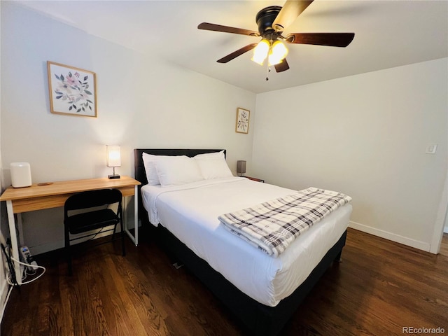 bedroom with dark wood-type flooring, ceiling fan, and baseboards