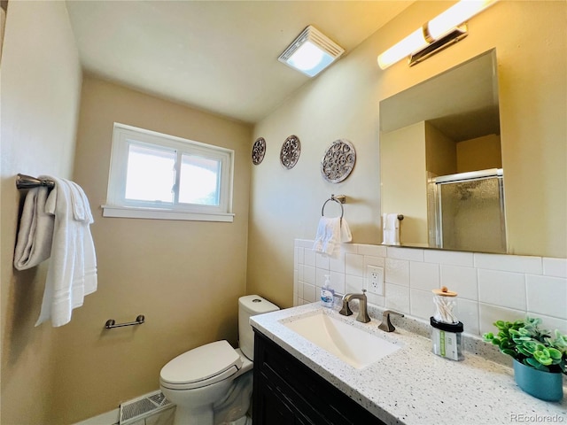 bathroom with visible vents, backsplash, toilet, vanity, and a shower stall