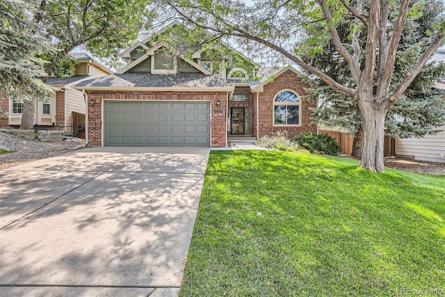 view of front of home with an attached garage, brick siding, fence, concrete driveway, and a front lawn