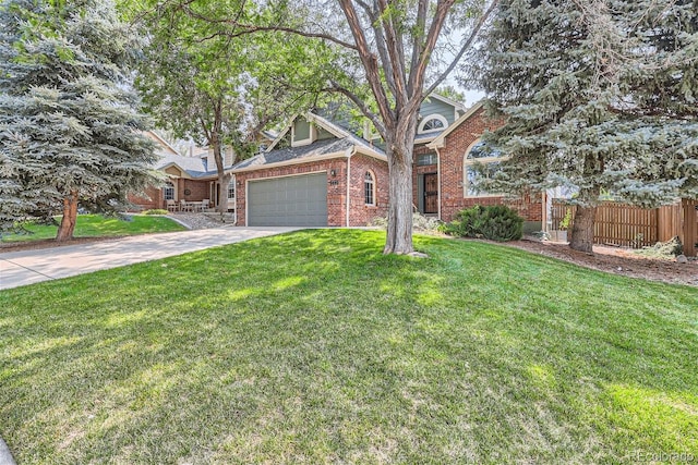 view of front of property with brick siding, concrete driveway, fence, a garage, and a front lawn