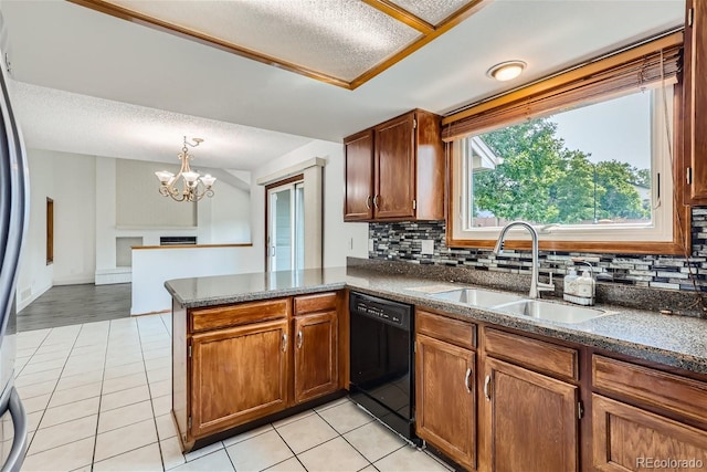 kitchen with a sink, light tile patterned floors, a peninsula, and dishwasher