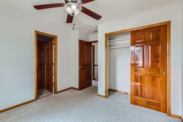 unfurnished bedroom with light carpet, visible vents, baseboards, and a closet