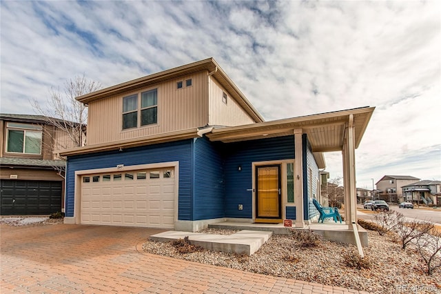 view of front of house with a porch and a garage