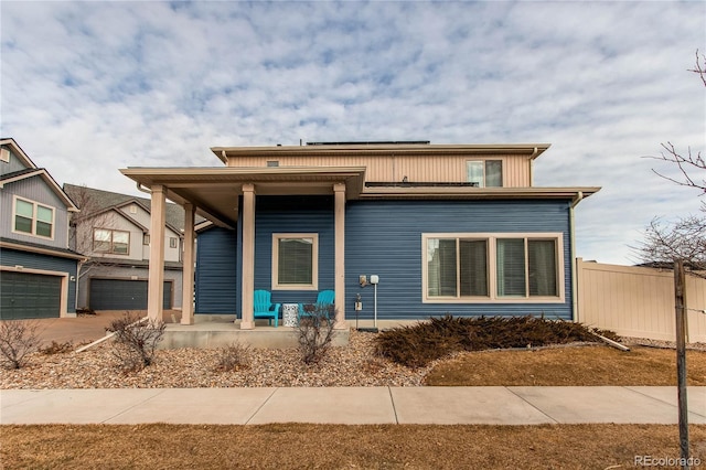 view of front of house featuring covered porch and a garage