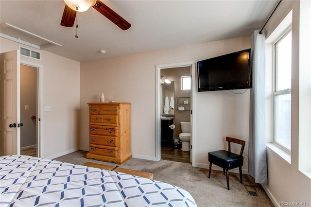 carpeted bedroom featuring ceiling fan and connected bathroom