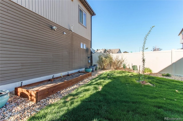 view of yard with a fenced backyard