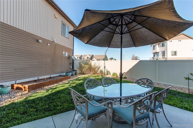 view of patio / terrace with outdoor dining area and a fenced backyard
