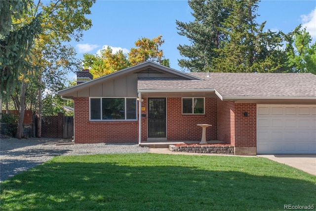 single story home featuring a garage and a front yard