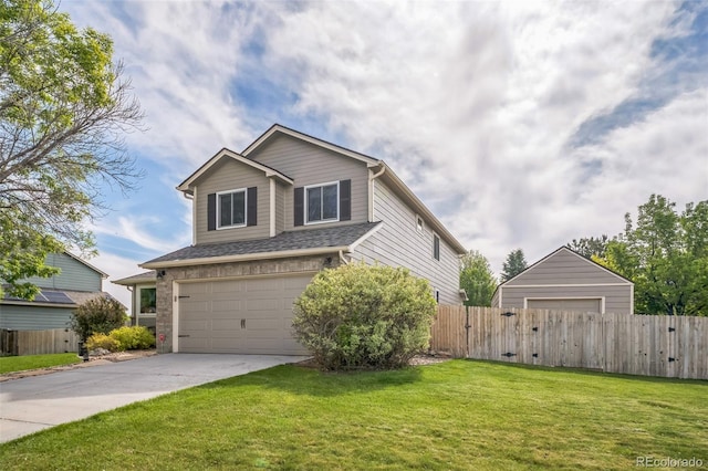traditional-style home featuring an attached garage and concrete driveway
