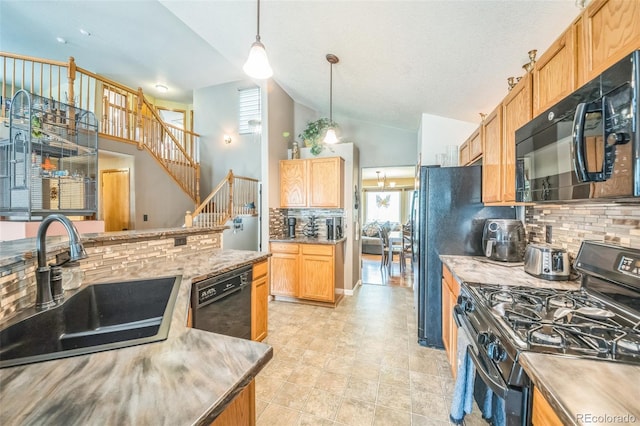 kitchen featuring black appliances, a sink, backsplash, hanging light fixtures, and light countertops
