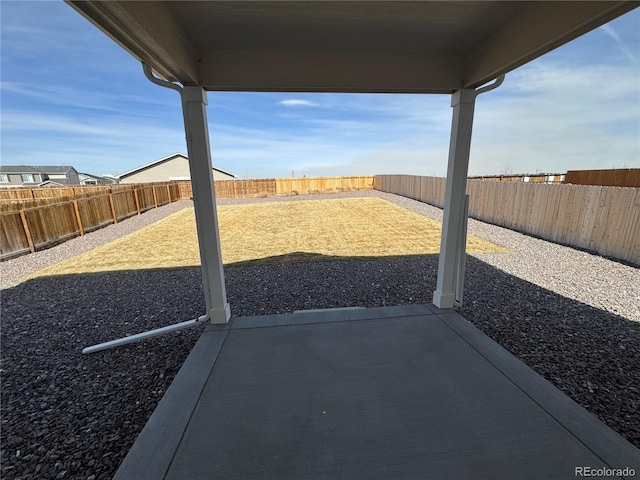 view of yard with a fenced backyard and a patio