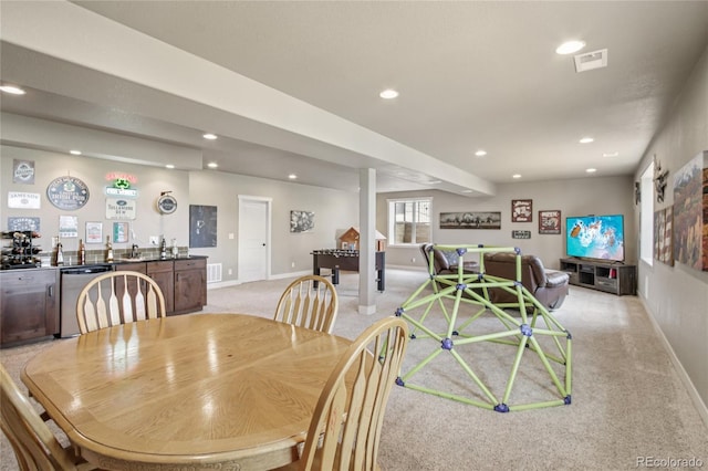 7258 Spanish Bay Dr, Windsor, CO 80550 - dining area with wet bar, light colored carpet, and recessed lighting