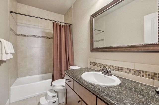 7258 Spanish Bay Dr, Windsor, CO 80550 - full bath with shower / bathtub combination with curtain, vanity, decorative backsplash, and a textured wall
