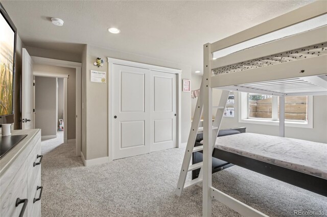 7258 Spanish Bay Dr, Windsor, CO 80550 - carpeted bedroom featuring a closet and recessed lighting