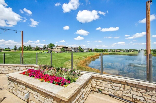 7258 Spanish Bay Dr, Windsor, CO 80550 - view of patio featuring a water view