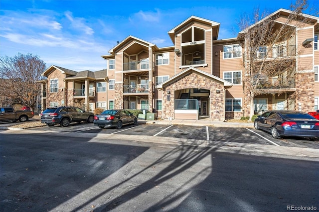 10805 Twenty Mile Rd Unit 307, Parker, CO 80134 - view of apartment building / complex with uncovered parking