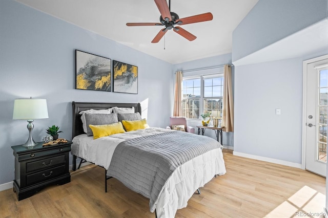 bedroom featuring hardwood / wood-style floors, access to outside, and ceiling fan