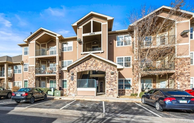 10805 Twenty Mile Rd Unit 307, Parker, CO 80134 - view of apartment building / complex featuring uncovered parking