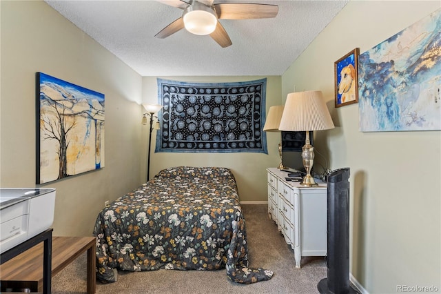 bedroom featuring ceiling fan, carpet, and a textured ceiling