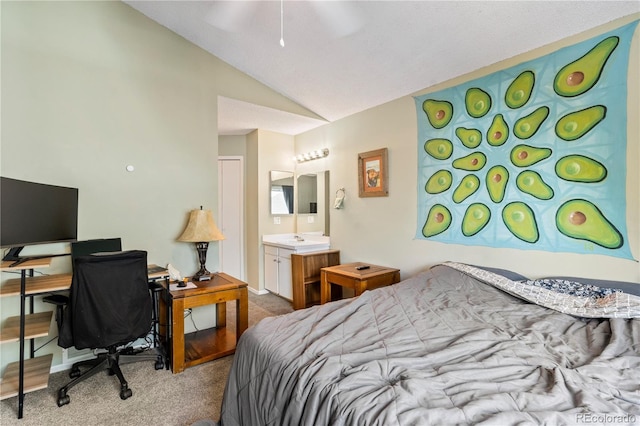 carpeted bedroom with connected bathroom, ceiling fan, and lofted ceiling