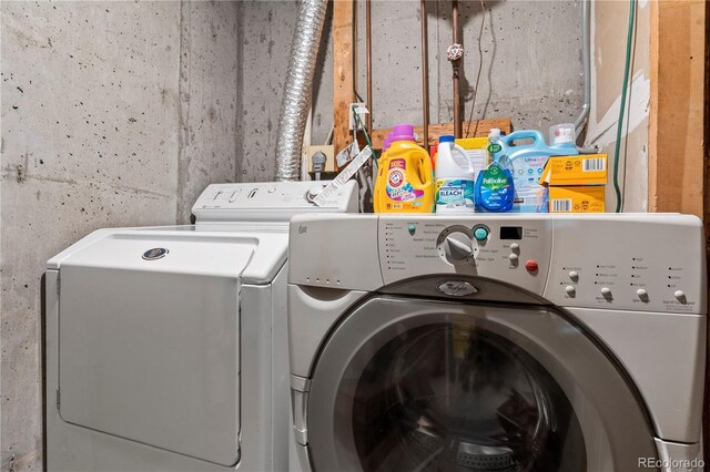 laundry room with washer and clothes dryer