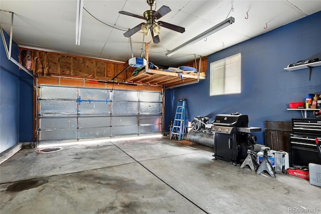 garage featuring a garage door opener and ceiling fan