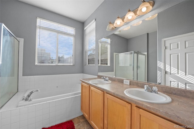 full bath featuring a shower stall, a bath, double vanity, and tile patterned floors