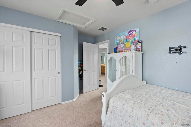 carpeted bedroom featuring attic access, a closet, baseboards, and a ceiling fan