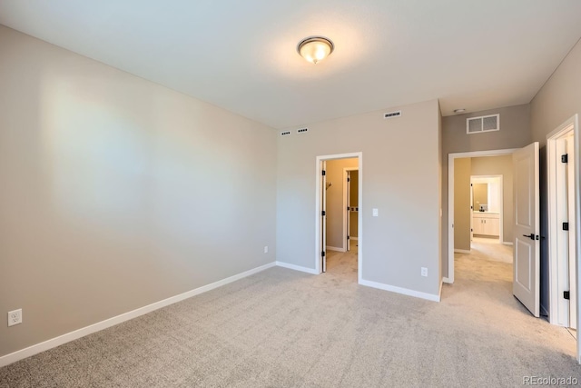 unfurnished bedroom featuring light colored carpet