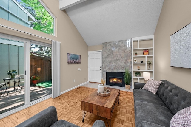 11704 Elk Head Range Rd, Littleton, CO 80127 - living room with high vaulted ceiling, a tiled fireplace, and a textured ceiling