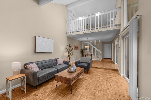 11704 Elk Head Range Rd, Littleton, CO 80127 - living area with a high ceiling and stairway