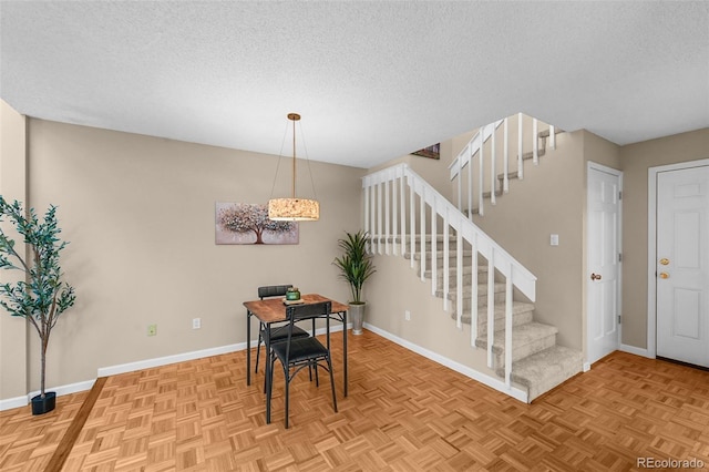 11704 Elk Head Range Rd, Littleton, CO 80127 - dining space with a textured ceiling and stairway