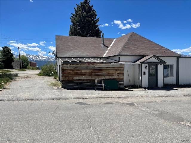 exterior space with a shingled roof