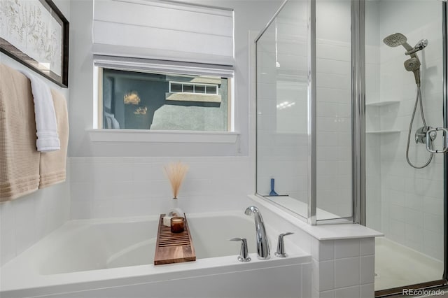 13736 Umatilla Ln, Broomfield, CO 80023 - bathroom featuring a bath and a stall shower