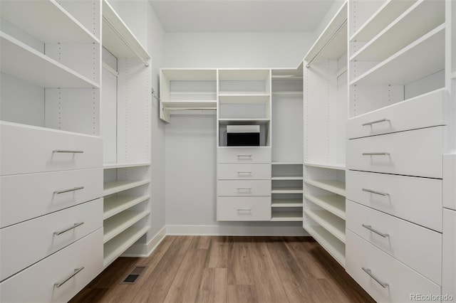 13736 Umatilla Ln, Broomfield, CO 80023 - walk in closet with dark wood-type flooring