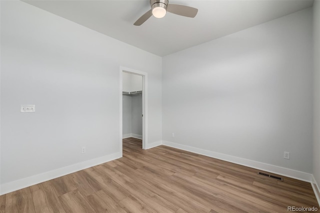 13736 Umatilla Ln, Broomfield, CO 80023 - unfurnished bedroom with light wood-style floors, a walk in closet, and ceiling fan