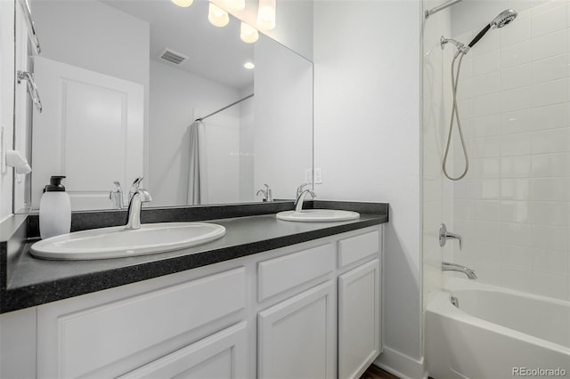 13736 Umatilla Ln, Broomfield, CO 80023 - bathroom featuring shower / bath combo with shower curtain and double vanity