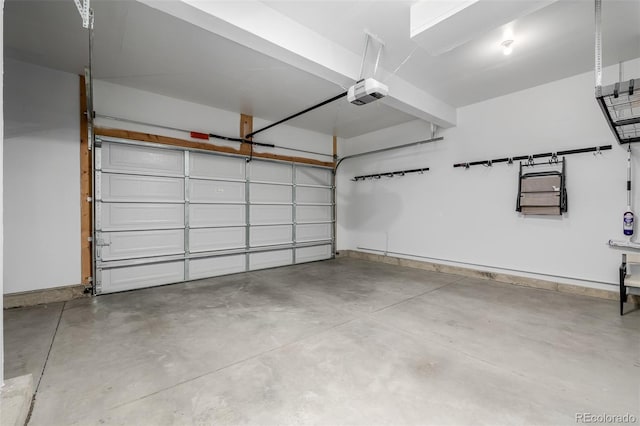 13736 Umatilla Ln, Broomfield, CO 80023 - garage featuring a garage door opener and baseboards