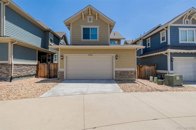 13736 Umatilla Ln, Broomfield, CO 80023 - craftsman-style home with an attached garage, stone siding, and concrete driveway