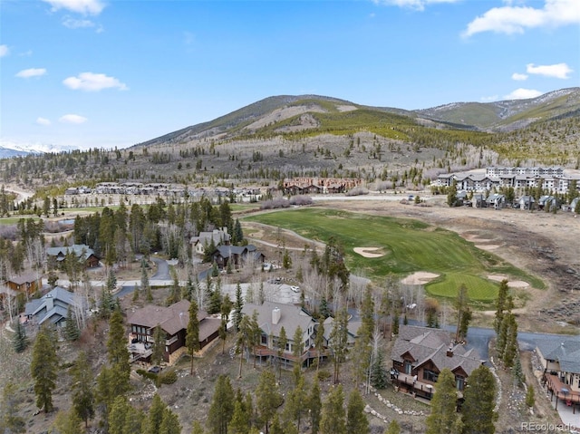 drone / aerial view with a residential view, a mountain view, and view of golf course