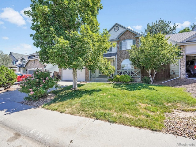 3661 Seramonte Dr, Highlands Ranch, CO 80129 - view of property hidden behind natural elements with stone siding, a front yard, driveway, and a garage