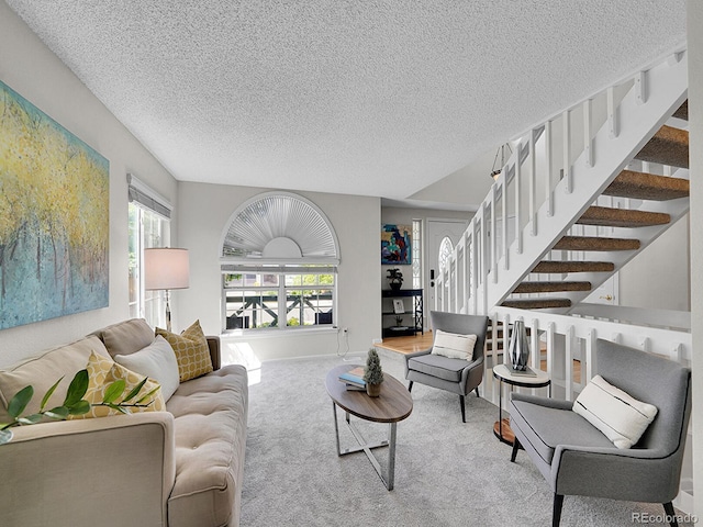 3661 Seramonte Dr, Highlands Ranch, CO 80129 - living area with carpet, a textured ceiling, stairway, and plenty of natural light
