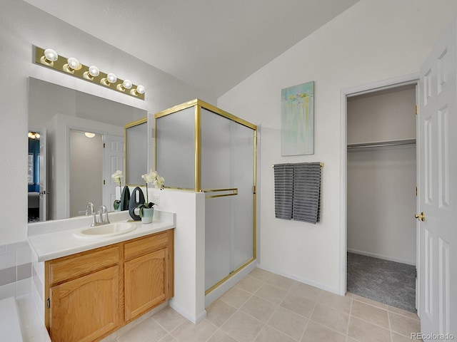 3661 Seramonte Dr, Highlands Ranch, CO 80129 - full bathroom with vanity, a stall shower, a spacious closet, tile patterned flooring, and lofted ceiling