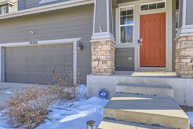 view of snow covered property entrance